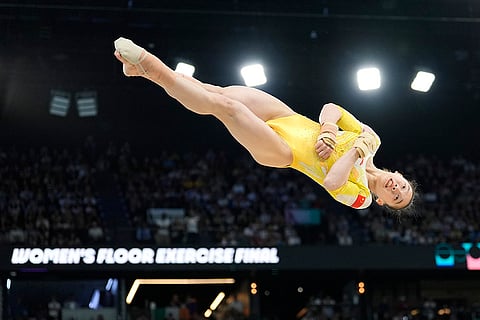 Ou Yushan competes during the women's artistic gymnastics individual floor finals